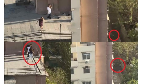 Bakıda qızlar binanın damında içki içib butulkanı insanların başına atdı - VİDEO