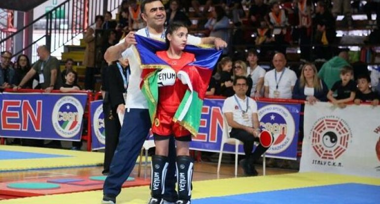 Dünya çempionu Əminə Əliyeva Bakıya qayıtdı